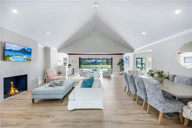 4701 Oak Leaf Dr, Naples, FL 34119 - living area featuring recessed lighting, vaulted ceiling, wood finished floors, a fireplace, and baseboards