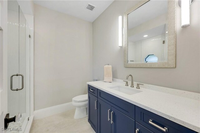 4701 Oak Leaf Dr, Naples, FL 34119 - full bath featuring toilet, vanity, a shower stall, baseboards, and tile patterned floors