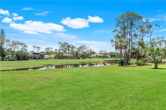 4701 Oak Leaf Dr, Naples, FL 34119 - surrounding community featuring a water view and a lawn