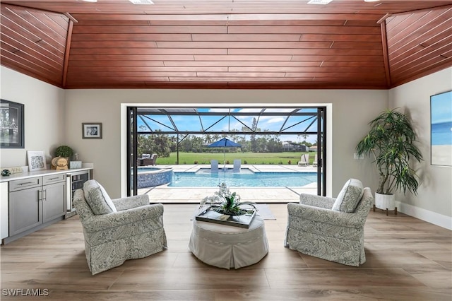 4701 Oak Leaf Dr, Naples, FL 34119 - living area with wooden ceiling, lofted ceiling, a sunroom, wine cooler, and light wood-type flooring