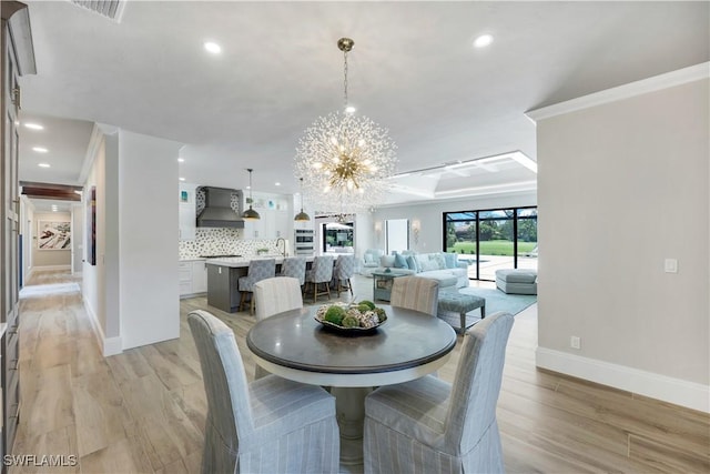4701 Oak Leaf Dr, Naples, FL 34119 - dining room with a chandelier, baseboards, recessed lighting, light wood-type flooring, and ornamental molding
