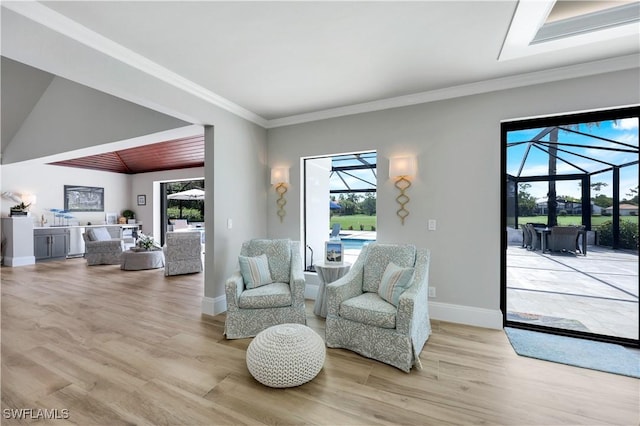 4701 Oak Leaf Dr, Naples, FL 34119 - sitting room with a sunroom, plenty of natural light, wood finished floors, baseboards, and ornamental molding