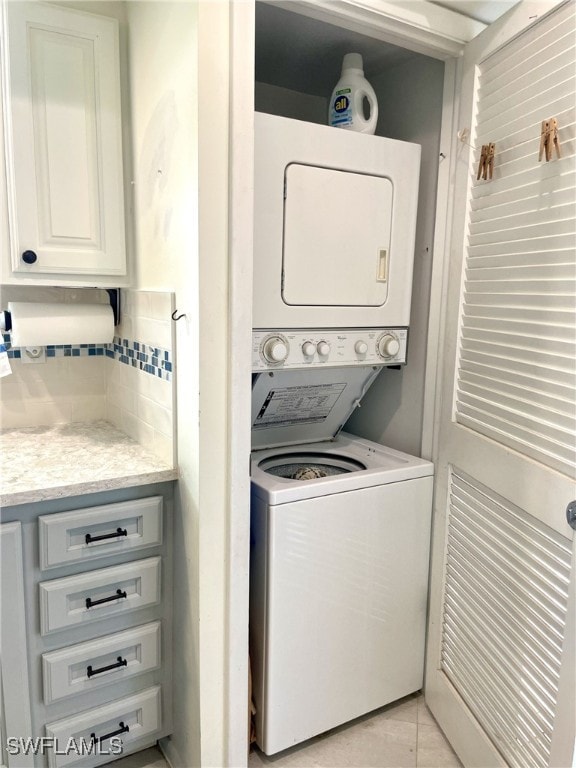 325 Charlemagne Blvd Unit B207, Naples, FL 34112 - washroom with stacked washing machine and dryer