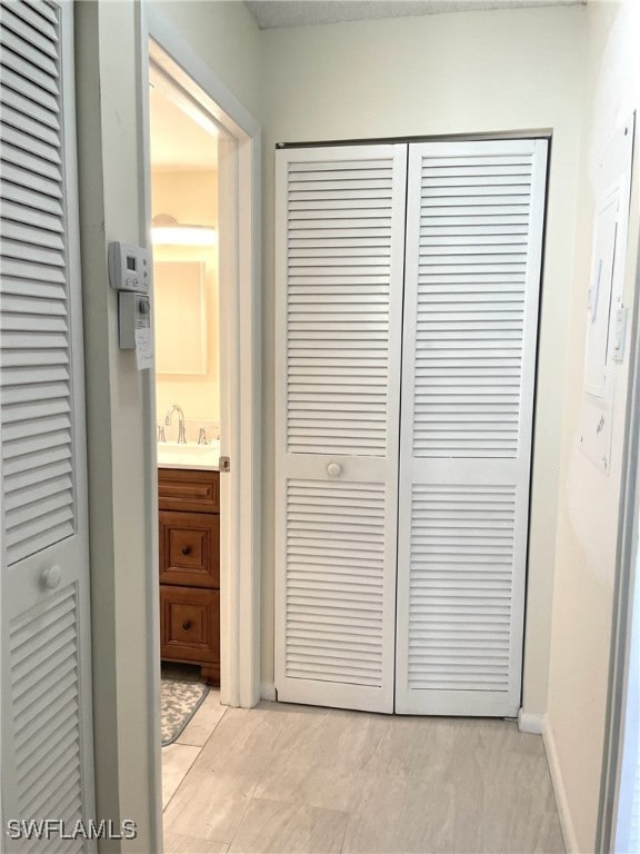 325 Charlemagne Blvd Unit B207, Naples, FL 34112 - hall featuring a sink and baseboards