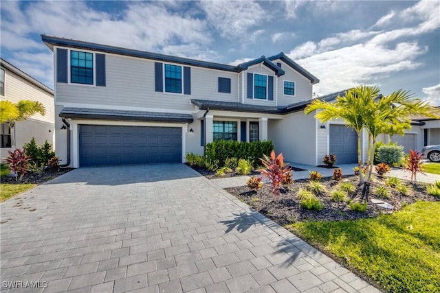 11260 Canopy Loop, Fort Myers, FL 33913 - traditional-style home with a garage, decorative driveway, and stucco siding