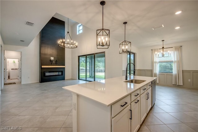 11260 Canopy Loop, Fort Myers, FL 33913 - kitchen featuring a sink, a chandelier, open floor plan, light tile patterned floors, and an island with sink