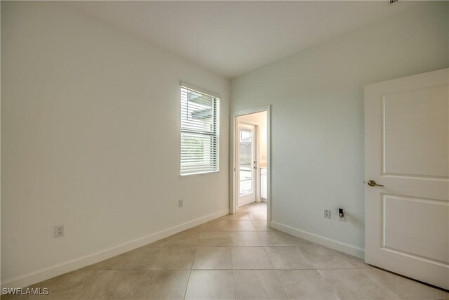 11260 Canopy Loop, Fort Myers, FL 33913 - unfurnished bedroom with baseboards and light tile patterned floors