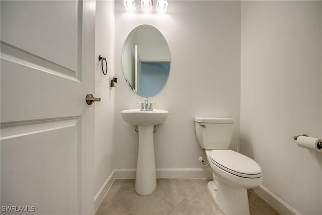 11260 Canopy Loop, Fort Myers, FL 33913 - bathroom with toilet, tile patterned flooring, and baseboards