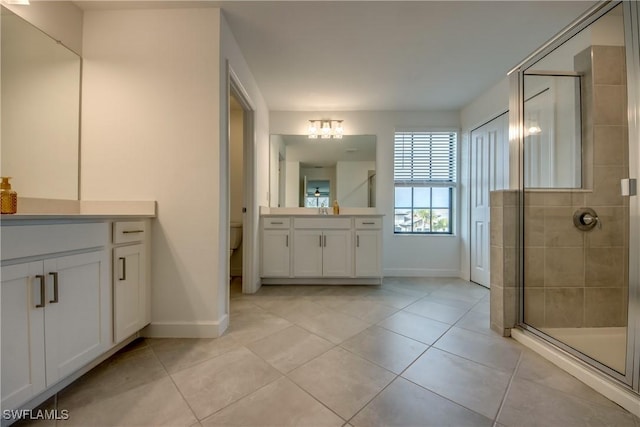 11260 Canopy Loop, Fort Myers, FL 33913 - full bathroom featuring vanity, baseboards, a shower stall, and tile patterned flooring