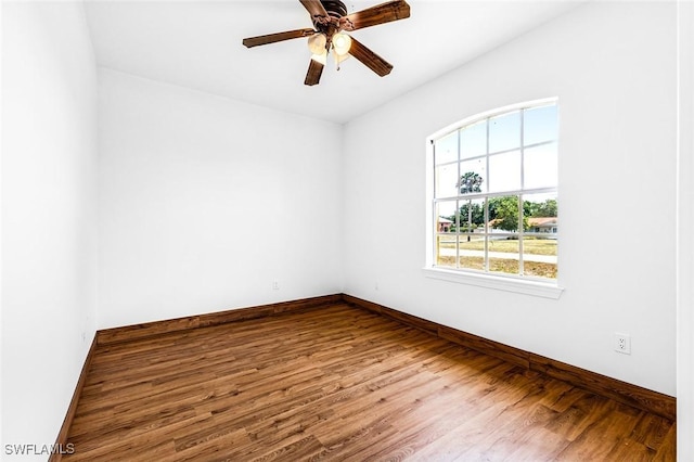 707 8th Ave, Lehigh Acres, FL 33972 - unfurnished room featuring wood finished floors, ceiling fan, and baseboards