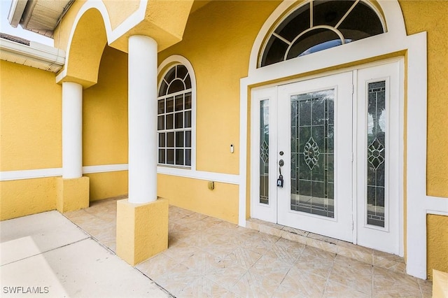 707 8th Ave, Lehigh Acres, FL 33972 - property entrance with stucco siding and french doors