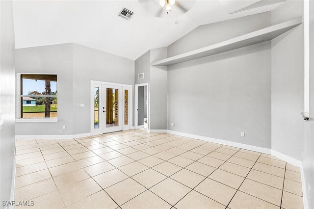 707 8th Ave, Lehigh Acres, FL 33972 - unfurnished room featuring high vaulted ceiling, a ceiling fan, tile patterned floors, and baseboards