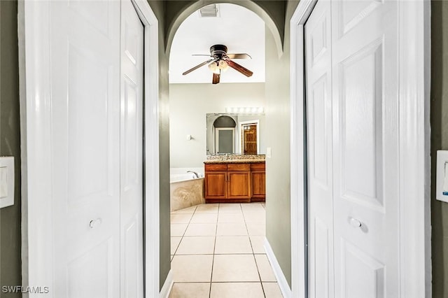 707 8th Ave, Lehigh Acres, FL 33972 - full bathroom with a closet, vanity, and ceiling fan