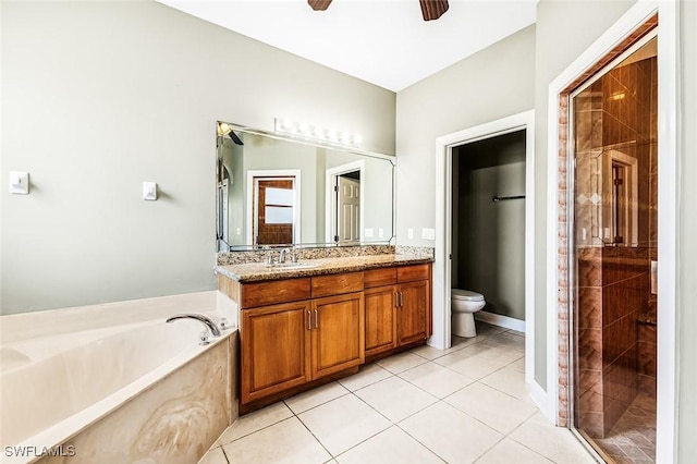 707 8th Ave, Lehigh Acres, FL 33972 - full bathroom featuring a ceiling fan, a garden tub, double vanity, toilet, and a shower stall