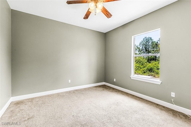 707 8th Ave, Lehigh Acres, FL 33972 - unfurnished room featuring carpet floors, baseboards, and ceiling fan