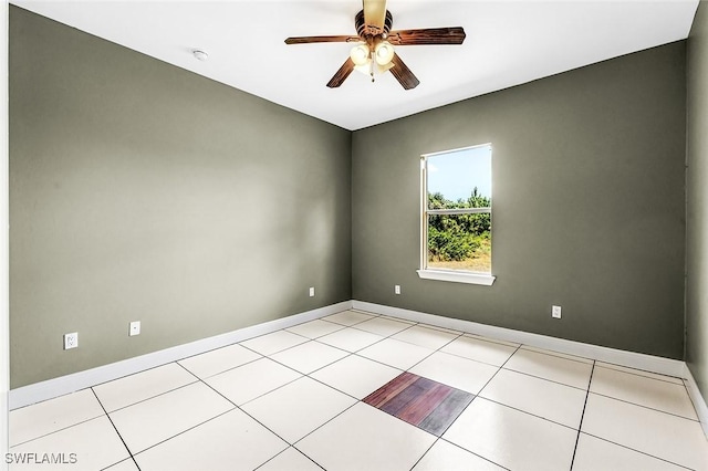 707 8th Ave, Lehigh Acres, FL 33972 - unfurnished room with ceiling fan, baseboards, a smoke detector, and light tile patterned floors