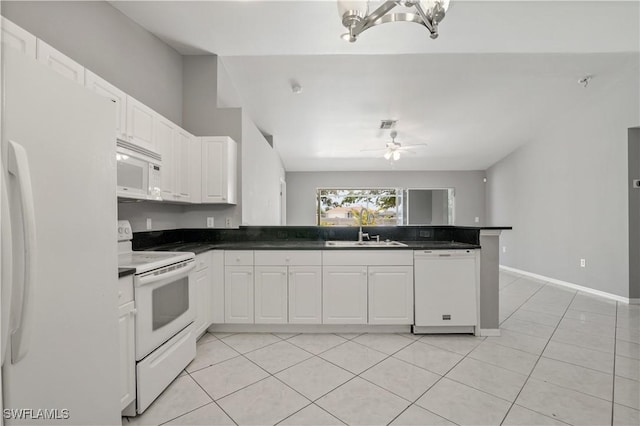 2903 NW 5th Pl, Cape Coral, FL 33993 - kitchen featuring white appliances, a sink, a peninsula, ceiling fan, and white cabinetry