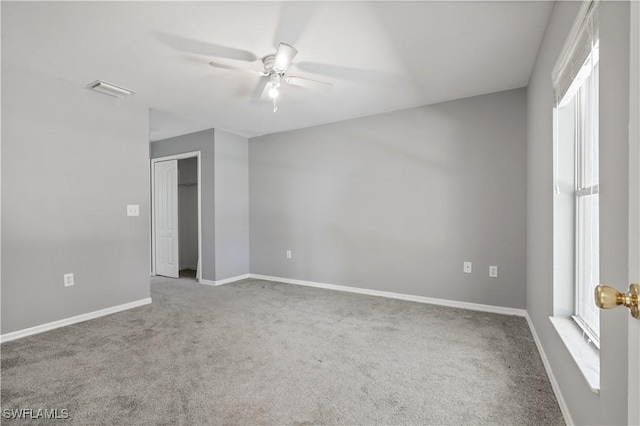 2903 NW 5th Pl, Cape Coral, FL 33993 - carpeted empty room with ceiling fan, baseboards, and plenty of natural light