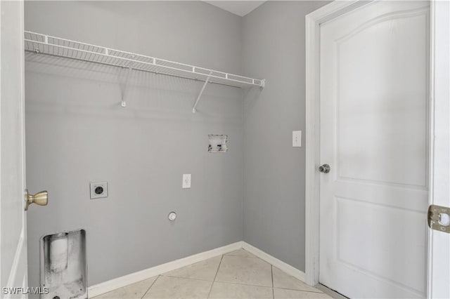 2903 NW 5th Pl, Cape Coral, FL 33993 - laundry area with hookup for a washing machine, electric dryer hookup, baseboards, light tile patterned floors, and gas dryer hookup