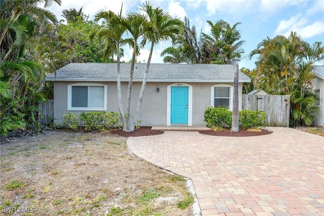 856 104th Ave N, Naples, FL 34108 - view of front facade featuring stucco siding