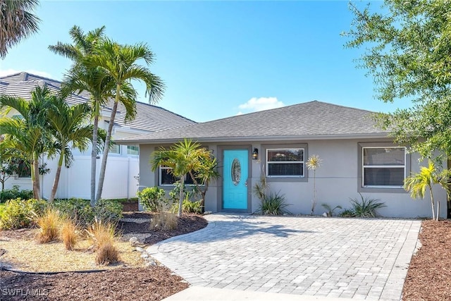 736 94th Ave N, Naples, FL 34108 - ranch-style home with stucco siding and a shingled roof