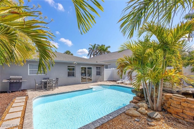 736 94th Ave N, Naples, FL 34108 - view of swimming pool featuring grilling area and a patio area