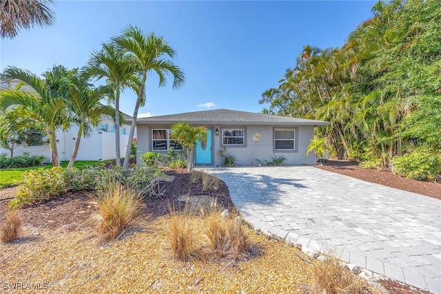 736 94th Ave N, Naples, FL 34108 - single story home with stucco siding and decorative driveway