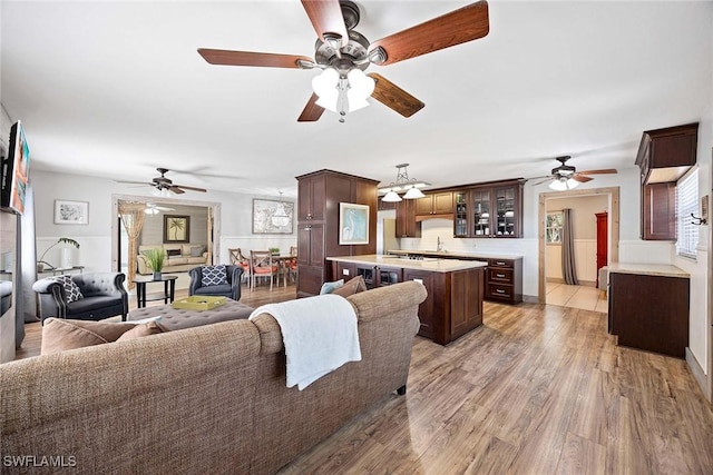 736 94th Ave N, Naples, FL 34108 - living area featuring ceiling fan, a chandelier, and light wood-style flooring