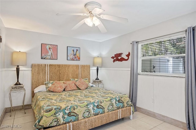 736 94th Ave N, Naples, FL 34108 - tiled bedroom with wainscoting and ceiling fan