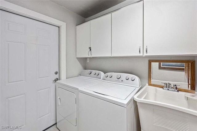 736 94th Ave N, Naples, FL 34108 - laundry area featuring independent washer and dryer and cabinet space