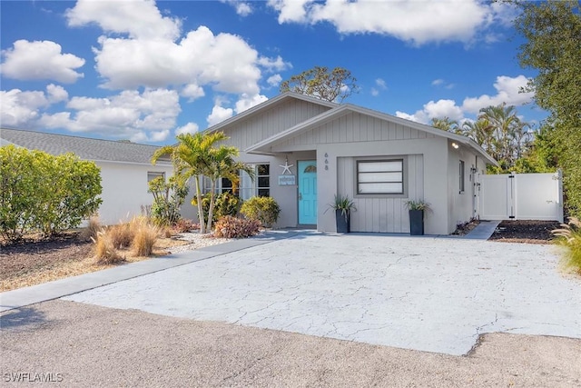 668 94th Ave N, Naples, FL 34108 - single story home with driveway and a gate