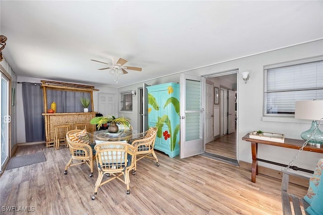 668 94th Ave N, Naples, FL 34108 - dining area featuring wood finished floors, ceiling fan, and baseboards