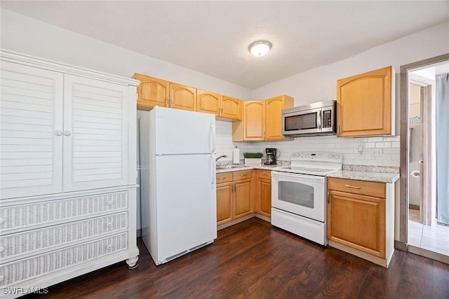 668 94th Ave N, Naples, FL 34108 - kitchen featuring white appliances, a sink, dark wood-type flooring, and tasteful backsplash