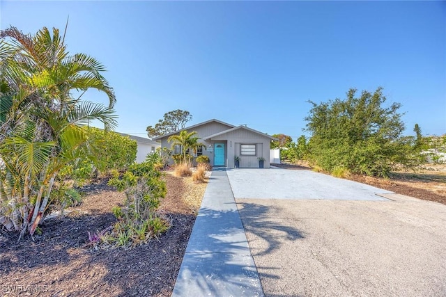 668 94th Ave N, Naples, FL 34108 - ranch-style home with dirt driveway