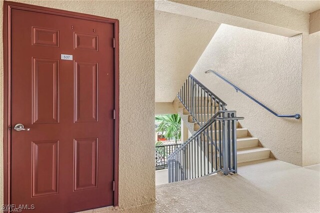 9731 Acqua Ct Unit 537, Naples, FL 34113 - view of exterior entry with stucco siding