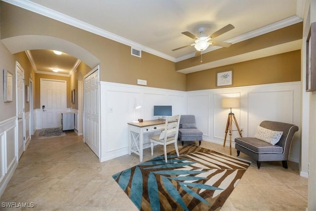 9731 Acqua Ct Unit 537, Naples, FL 34113 - office with a decorative wall, arched walkways, crown molding, a ceiling fan, and a wainscoted wall