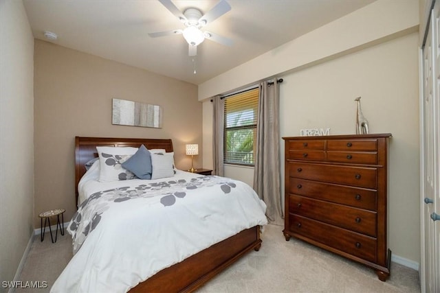 9731 Acqua Ct Unit 537, Naples, FL 34113 - bedroom with light colored carpet, baseboards, and a ceiling fan
