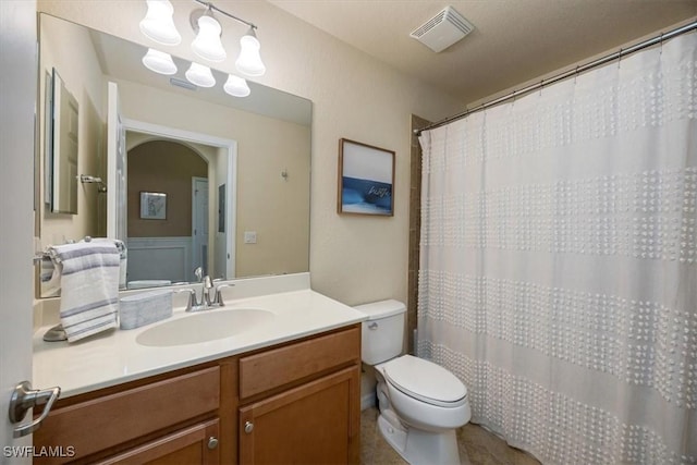 9731 Acqua Ct Unit 537, Naples, FL 34113 - bathroom featuring toilet, vanity, and a shower with curtain