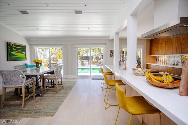 5880 Shady Oaks Ln, Naples, FL 34119 - dining area featuring light wood-style flooring and wooden ceiling