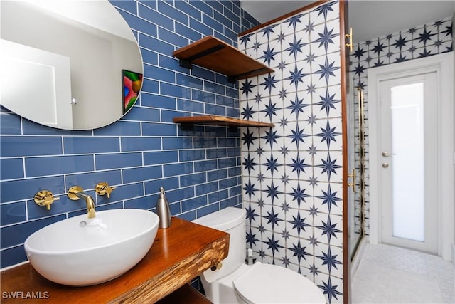 5880 Shady Oaks Ln, Naples, FL 34119 - full bath with a sink, tile walls, toilet, a shower, and tile patterned flooring