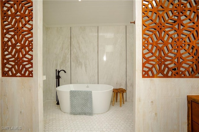 5880 Shady Oaks Ln, Naples, FL 34119 - full bath featuring a freestanding bath, vanity, and tile patterned flooring