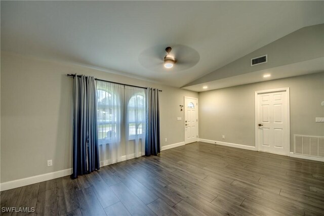 14160 Cedardale St, Fort Myers, FL 33905 - foyer entrance featuring ceiling fan, vaulted ceiling, dark wood-type flooring, and baseboards