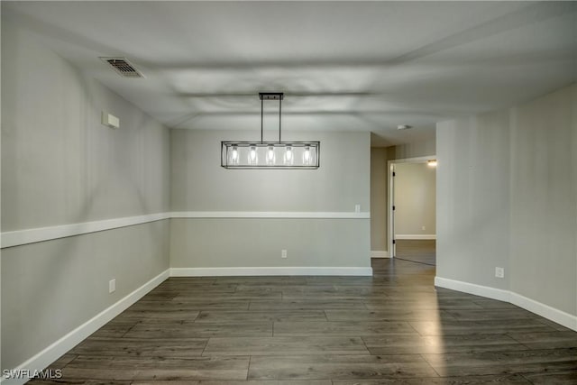 14160 Cedardale St, Fort Myers, FL 33905 - unfurnished dining area with wood finished floors and baseboards