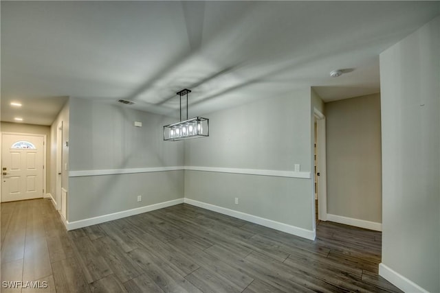 14160 Cedardale St, Fort Myers, FL 33905 - unfurnished dining area with baseboards and dark wood-style flooring