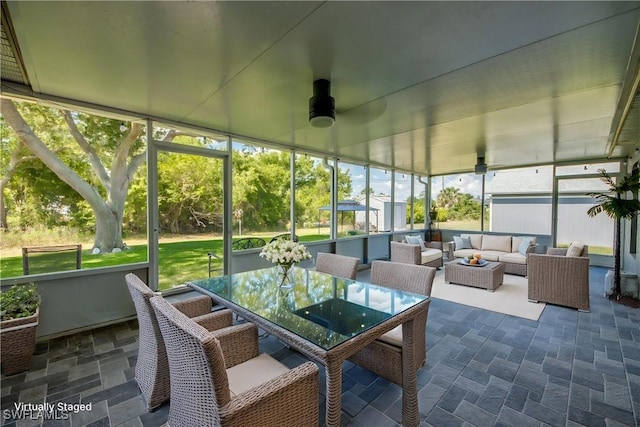 14160 Cedardale St, Fort Myers, FL 33905 - sunroom with an outdoor living space, a ceiling fan, and outdoor dining area
