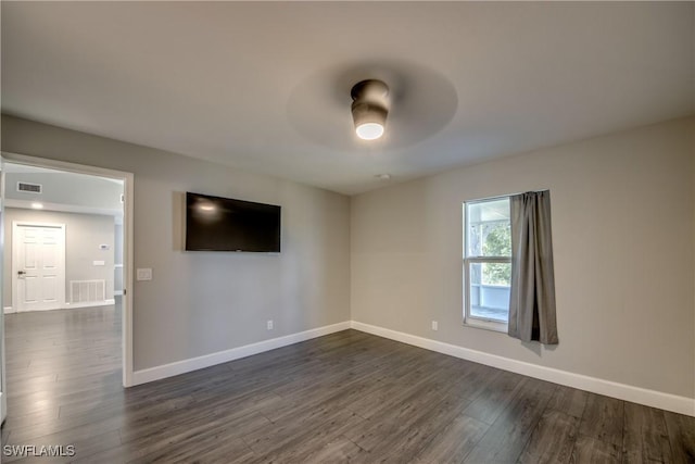 14160 Cedardale St, Fort Myers, FL 33905 - empty room with baseboards, dark wood-style flooring, and ceiling fan