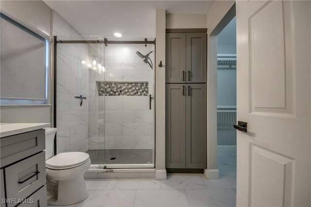 14160 Cedardale St, Fort Myers, FL 33905 - full bathroom with marble finish floors, a stall shower, toilet, vanity, and a walk in closet