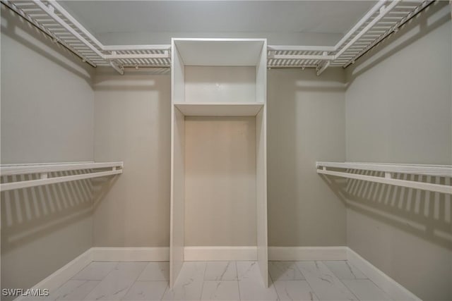 14160 Cedardale St, Fort Myers, FL 33905 - walk in closet featuring marble look tiles