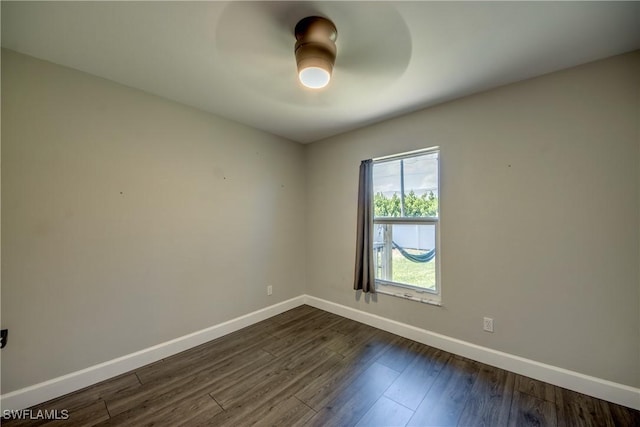 14160 Cedardale St, Fort Myers, FL 33905 - spare room with baseboards, ceiling fan, and dark wood-style floors