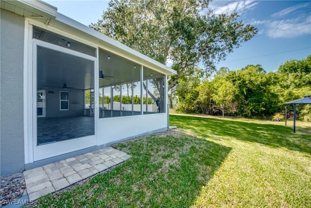 14160 Cedardale St, Fort Myers, FL 33905 - view of green lawn with a sunroom